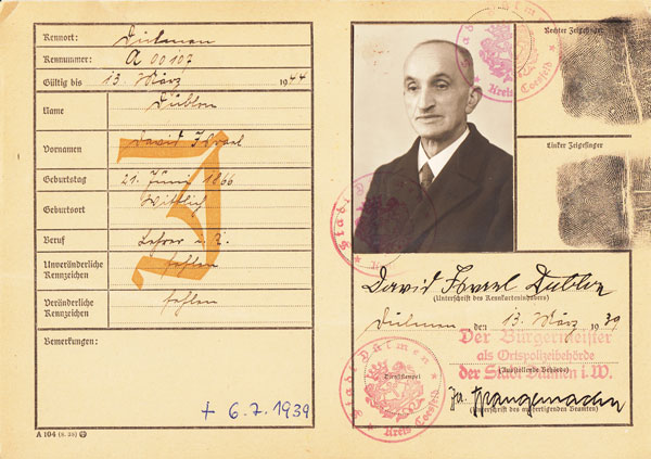 Card with capital ‘J’ on left; on the right, a photograph of David Dublon, with his signature and fingerprints.
